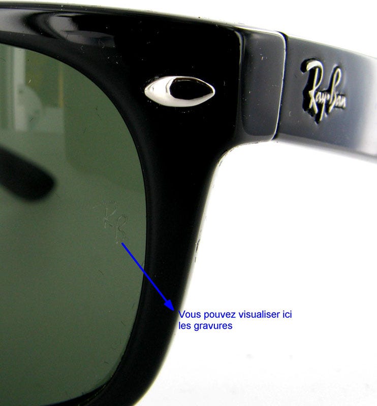 Gros plan sur la gravure laser RB sur le verre gauche d'une paire de Ray-Ban authentique